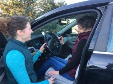Susie, Certified Driver Specialist & Occupational Therapist, works with a driver.