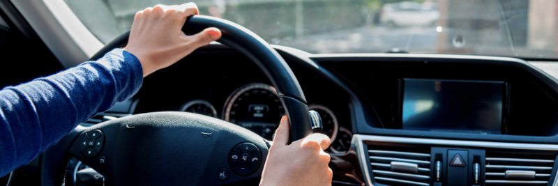 A person driving a car.