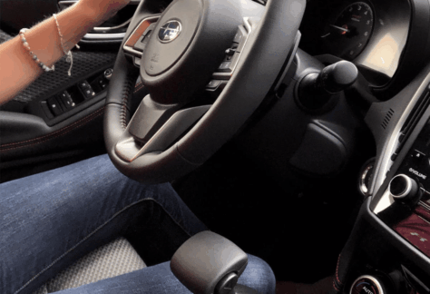 A person using adaptive driving equipment