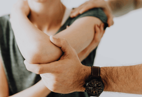 An OT helping someone