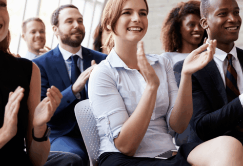Conference attendees clapping